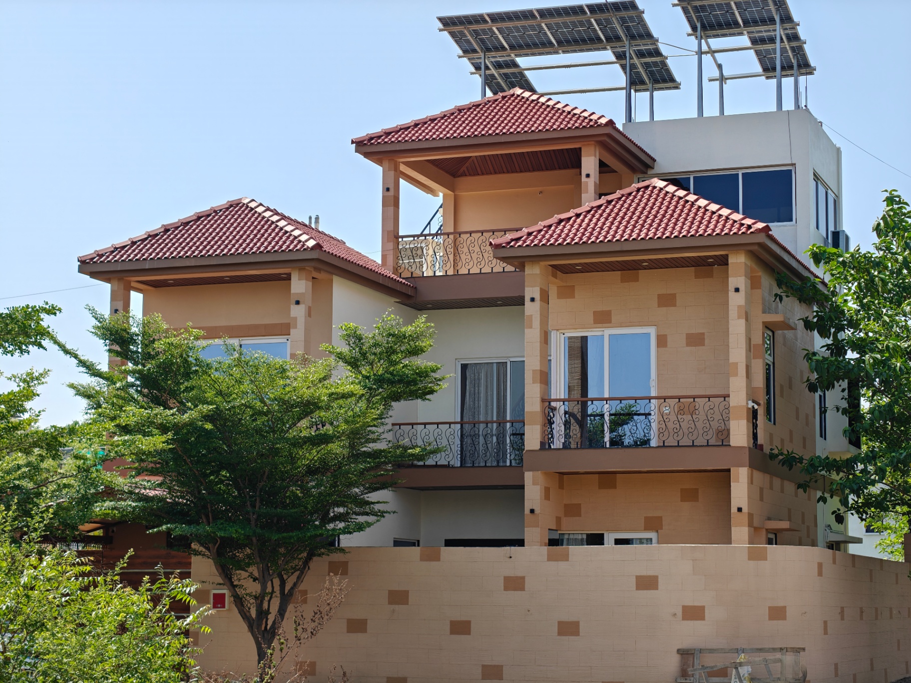 Pearl Villa exterior — tiled roofs and balconies