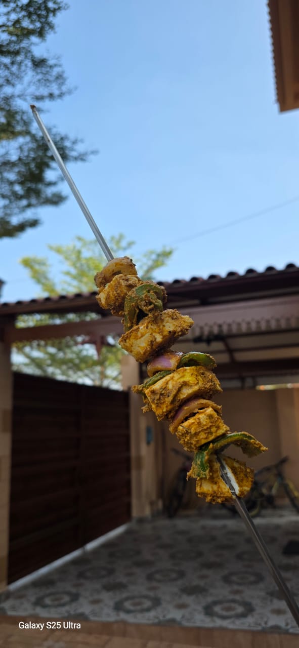 Freshly grilled paneer tikka skewers